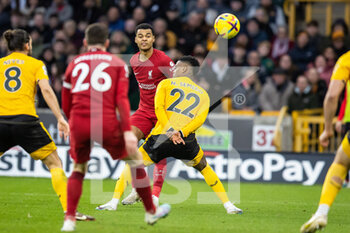 2023-02-04 - Liverpool forward Cody Gakpo (18) crosses the ball during the English championship Premier League football match between Wolverhampton Wanderers and Liverpool on February 4, 2023 at Molineux stadium in Wolverhampton, England - FOOTBALL - ENGLISH CHAMP - WOLVERHAMPTON V LIVERPOOL - ENGLISH PREMIER LEAGUE - SOCCER