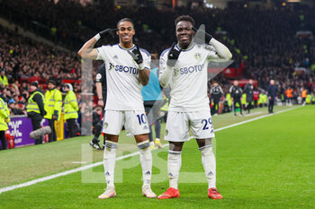 2023-02-08 - Leeds United midfielder Crysencio Summerville (10) and Leeds United forward Wilfried Gnonto (29) celebrate Leeds United 2nd goal scored by Manchester United defender Raphael Varane (19) 0-2 during the English championship Premier League football match between Manchester United and Leeds United on February 8, 2023 at Old Trafford in Manchester, England - FOOTBALL - ENGLISH CHAMP - MANCHESTER UNITED V LEEDS - ENGLISH PREMIER LEAGUE - SOCCER
