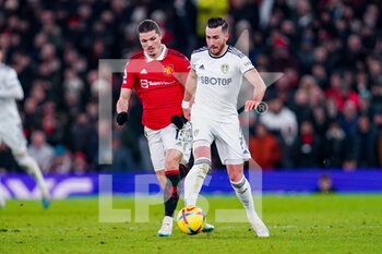 2023-02-08 - Leeds United midfielder Jack Harrison (11) and Marcel Sabitzer of Manchester United during the English championship Premier League football match between Manchester United and Leeds United on February 8, 2023 at Old Trafford in Manchester, England - FOOTBALL - ENGLISH CHAMP - MANCHESTER UNITED V LEEDS - ENGLISH PREMIER LEAGUE - SOCCER