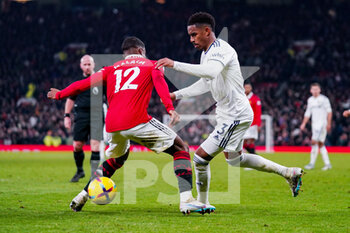 2023-02-08 - Leeds United defender Junior Firpo (3) and Manchester United defender Tyrell Malacia (12) during the English championship Premier League football match between Manchester United and Leeds United on February 8, 2023 at Old Trafford in Manchester, England - FOOTBALL - ENGLISH CHAMP - MANCHESTER UNITED V LEEDS - ENGLISH PREMIER LEAGUE - SOCCER