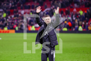 2023-02-08 - Leeds United Caretaker Manager Michael Skubala applauds the fans during the English championship Premier League football match between Manchester United and Leeds United on February 8, 2023 at Old Trafford in Manchester, England - FOOTBALL - ENGLISH CHAMP - MANCHESTER UNITED V LEEDS - ENGLISH PREMIER LEAGUE - SOCCER