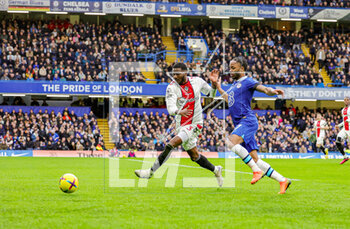 2023-02-19 - Ainsley Maitland-Niles (3) of Southampton battles with Raheem Sterling (17) of Chelsea during the English championship Premier League football match between Chelsea and Southampton on February 18, 2023 at Stamford Bridge in London, England - FOOTBALL - ENGLISH CHAMP - CHELSEA V SOUTHAMPTON - ENGLISH PREMIER LEAGUE - SOCCER