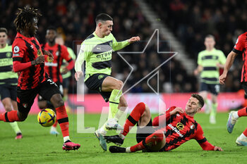 2023-02-25 - Phil Foden (47) of Manchester City is tackled by Chris Mepham (6) of AFC Bournemouth during the English championship Premier League football match between Bournemouth and Manchester City on 25 February 2023 at the Vitality Stadium in Bournemouth, England - FOOTBALL - ENGLISH CHAMP - BOURNEMOUTH V MANCHESTER CITY - ENGLISH PREMIER LEAGUE - SOCCER