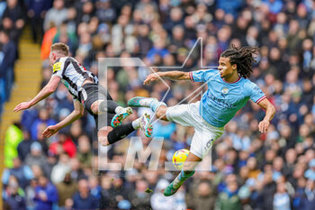 2023-03-05 - Sean Longstaff (36) of Newcastle United and Nathan Ake (6) of Manchester City clash in the air during the English championship Premier League football match between Manchester City and Newcastle United on 4 March 2023 at the Etihad Stadium in Manchester, England - FOOTBALL - ENGLISH CHAMP - MANCHESTER CITY V NEWCASTLE - ENGLISH PREMIER LEAGUE - SOCCER