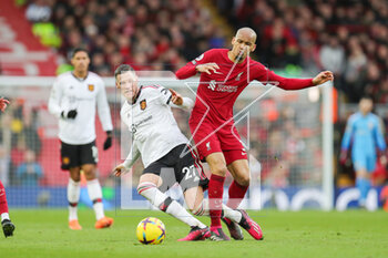 2023-03-06 - Manchester United forward Wout Weghorst (28) and Liverpool midfielder Fabinho (3) during the English championship Premier League football match between Liverpool and Manchester United on 5 March 2023 at Anfield in Liverpool, England - FOOTBALL - ENGLISH CHAMP - LIVERPOOL V MANCHESTER UNITED - ENGLISH PREMIER LEAGUE - SOCCER