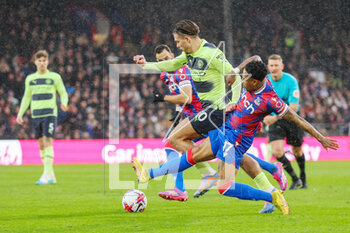 2023-03-11 - Crystal Palace defender Nathaniel Clyne (17) slide tackles Manchester City midfielder Jack Grealish (10) during the English championship Premier League football match between Crystal Palace and Manchester City on 11 March 2023 at Selhurst Park in London, England - FOOTBALL - ENGLISH CHAMP - CRYSTAL PALACE V MANCHESTER CITY - ENGLISH PREMIER LEAGUE - SOCCER