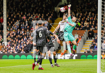 2023-03-13 - Aaron Ramsdale (1) of Arsenal and Aleksandar Mitrovic (9) of Fulham during the English championship Premier League football match between Fulham and Arsenal on 12 March 2023 at Craven Cottage in London, England - FOOTBALL - ENGLISH CHAMP - FULHAM V ARSENAL - ENGLISH PREMIER LEAGUE - SOCCER