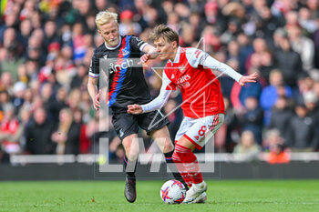 2023-03-19 - Arsenal midfielder Martin Odegaard (8) and Crystal Palace midfielder Will Hughes during the English championship Premier League football match between Arsenal and Crystal Palace on 19 March 2023 at the Emirates Stadium in London, England - FOOTBALL - ENGLISH CHAMP - ARSENAL V CRYSTAL PALACE - ENGLISH PREMIER LEAGUE - SOCCER