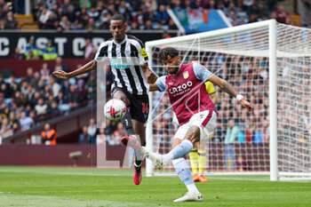2023-04-15 - Aston Villa defender Tyrone Mings (5) clears from Newcastle United forward Alexander Isak (14) during the English championship Premier League football match between Aston Villa and Newcastle United on 15 April 2023 at Villa Park in Birmingham, England - FOOTBALL - ENGLISH CHAMP - ASTON VILLA V NEWCASTLE - ENGLISH PREMIER LEAGUE - SOCCER