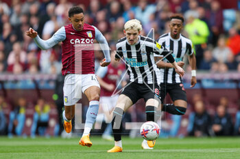 2023-04-15 - Newcastle United midfielder Anthony Gordon (8) and Jacob Ramsey of Aston Villa during the English championship Premier League football match between Aston Villa and Newcastle United on 15 April 2023 at Villa Park in Birmingham, England - FOOTBALL - ENGLISH CHAMP - ASTON VILLA V NEWCASTLE - ENGLISH PREMIER LEAGUE - SOCCER