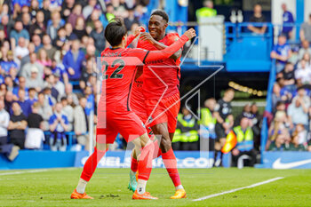 2023-04-15 - Danny Welbeck (18) of Brighton & Hove Albion scores a goal and celebrates 1-1 with Kaoru Mitoma during the English championship Premier League football match between Chelsea and Brighton and Hove Albion on 15 April 2023 at Stamford Bridge in London, England - FOOTBALL - ENGLISH CHAMP - CHELSEA V BRIGHTON - ENGLISH PREMIER LEAGUE - SOCCER