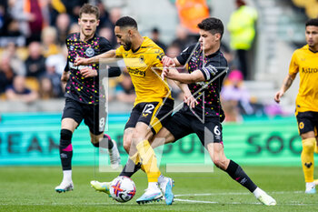 2023-04-15 - Wolverhampton Wanderers forward Matheus Cunha (12) battles for possession with Brentford midfielder Christian Norgaard (6) during the English championship Premier League football match between Wolverhampton Wanderers and Brentford on 15 April 2023 at Molineux stadium in Wolverhampton, England - FOOTBALL - ENGLISH CHAMP - WOLVERHAMPTON V BRENTFORD - ENGLISH PREMIER LEAGUE - SOCCER
