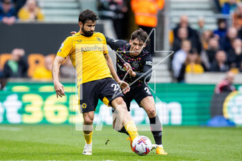 2023-04-15 - Wolverhampton Wanderers forward Diego Costa (29) and Aaron Hickey of Brentford during the English championship Premier League football match between Wolverhampton Wanderers and Brentford on 15 April 2023 at Molineux stadium in Wolverhampton, England - FOOTBALL - ENGLISH CHAMP - WOLVERHAMPTON V BRENTFORD - ENGLISH PREMIER LEAGUE - SOCCER