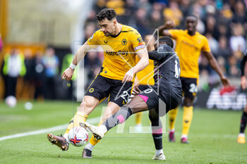 2023-04-15 - Wolverhampton Wanderers defender Max Kilman (23) battles for possession with Brentford midfielder Josh Dasilva (10) during the English championship Premier League football match between Wolverhampton Wanderers and Brentford on 15 April 2023 at Molineux stadium in Wolverhampton, England - FOOTBALL - ENGLISH CHAMP - WOLVERHAMPTON V BRENTFORD - ENGLISH PREMIER LEAGUE - SOCCER