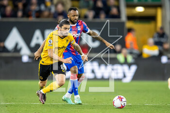 2023-04-25 - Wolverhampton Wanderers midfielder Ruben Neves and Jordan Ayew of Crystal Palace during the English championship Premier League football match between Wolverhampton Wanderers and Crystal Palace on 25 April 2023 at Molineux stadium in Wolverhampton, England - FOOTBALL - ENGLISH CHAMP - WOLVERHAMPTON V CRYSTAL PALACE - ENGLISH PREMIER LEAGUE - SOCCER