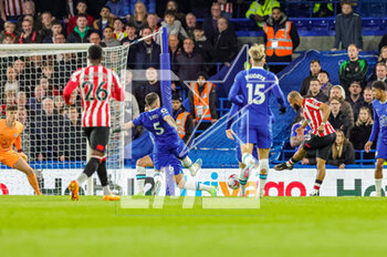 2023-04-26 - Bryan Mbeumo (19) of Brentford scores a goal 0-2 during the English championship Premier League football match between Chelsea and Brentford on 26 April 2023 at Stamford Bridge in London, England - FOOTBALL - ENGLISH CHAMP - CHELSEA V BRENTFORD - ENGLISH PREMIER LEAGUE - SOCCER