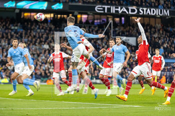 2023-04-26 - Manchester City defender John Stones (5) heads a goal 2-0 during the English championship Premier League football match between Manchester City and Arsenal on 26 April 2023 at the Etihad Stadium in Manchester, England - FOOTBALL - ENGLISH CHAMP - MANCHESTER CITY V ARSENAL - ENGLISH PREMIER LEAGUE - SOCCER