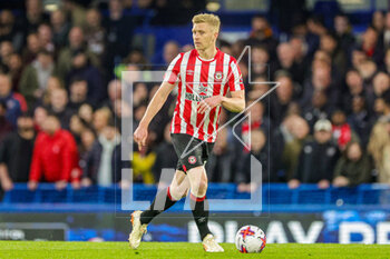 2023-04-27 - Ben Mee (16) of Brentford during the English championship Premier League football match between Chelsea and Brentford on 26 April 2023 at Stamford Bridge in London, England - FOOTBALL - ENGLISH CHAMP - CHELSEA V BRENTFORD - ENGLISH PREMIER LEAGUE - SOCCER