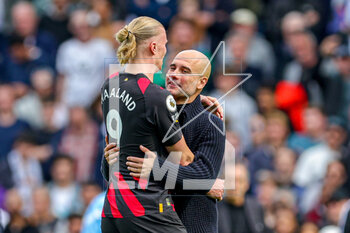 2023-04-30 - Pep Guardiola Manager of Manchester City celebrates at full time with Erling Haaland during the English championship Premier League football match between Fulham and Manchester City on 30 April 2023 at Craven Cottage in London, England - FOOTBALL - ENGLISH CHAMP - FULHAM V MANCHESTER CITY - ENGLISH PREMIER LEAGUE - SOCCER