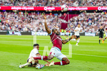 2023-05-08 - Michail Antonio (9) of West Ham United tackled by Tyrell Malacia (12) of Manchester United during the English championship Premier League football match between West Ham United and Manchester United on 7 May 2023 at the London Stadium in London, England - FOOTBALL - ENGLISH CHAMP - WEST HAM V MANCHESTER UNITED - ENGLISH PREMIER LEAGUE - SOCCER