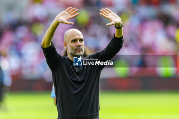 2023-05-29 - Pep Guardiola Manager of Manchester City thanks fans at full time during the English championship Premier League football match between Brentford and Manchester City on 28 May 2023 at Gtech Community Stadium in Brentford, England - FOOTBALL - ENGLISH CHAMP - BRENTFORD V MANCHESTER CITY - ENGLISH PREMIER LEAGUE - SOCCER
