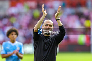 2023-05-29 - Pep Guardiola Manager of Manchester City thanks fans at full time during the English championship Premier League football match between Brentford and Manchester City on 28 May 2023 at Gtech Community Stadium in Brentford, England - FOOTBALL - ENGLISH CHAMP - BRENTFORD V MANCHESTER CITY - ENGLISH PREMIER LEAGUE - SOCCER