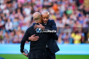 2023-08-11 - Vincent Kompany of Burnley (Manager) greets Josep Guardiola of Manchester City (Manager) during the English championship Premier League football match between Burnley and Manchester City on 11 August 2023 at Turf Moor in Burnley, England - FOOTBALL - ENGLISH CHAMP - BURNLEY V MANCHESTER CITY - ENGLISH PREMIER LEAGUE - SOCCER