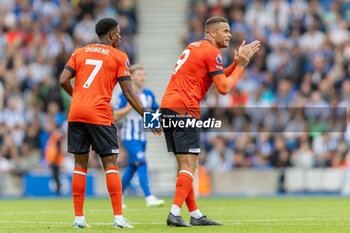2023-08-12 - Luton Town forward Carlton Morris (9) celebrates his goal 2-1 during the English championship Premier League football match between Brighton and Hove Albion and Luton Town on 12 August 2023 at the American Express Community Stadium in Brighton and Hove, England - FOOTBALL - ENGLISH CHAMP - BRIGHTON V LUTON TOWN - ENGLISH PREMIER LEAGUE - SOCCER