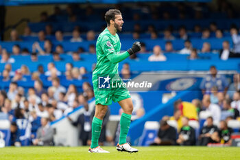2023-08-13 - Liverpool goalkeeper Alisson Becker (1) celebrates the 0-1 goal during the English championship Premier League football match between Chelsea and Liverpool on 13 August 2023 at Stamford Bridge in London, England - FOOTBALL - ENGLISH CHAMP - CHELSEA V LIVERPOOL - ENGLISH PREMIER LEAGUE - SOCCER