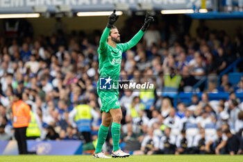 2023-08-13 - Liverpool goalkeeper Alisson Becker (1) celebrates the 0-1 goal during the English championship Premier League football match between Chelsea and Liverpool on 13 August 2023 at Stamford Bridge in London, England - FOOTBALL - ENGLISH CHAMP - CHELSEA V LIVERPOOL - ENGLISH PREMIER LEAGUE - SOCCER