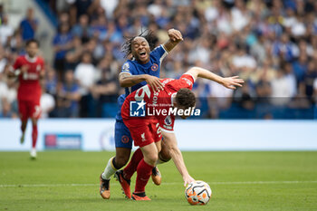 2023-08-13 - Liverpool defender Andrew Robertson (26) tackles Chelsea midfielder Raheem Sterling (7) during the English championship Premier League football match between Chelsea and Liverpool on 13 August 2023 at Stamford Bridge in London, England - FOOTBALL - ENGLISH CHAMP - CHELSEA V LIVERPOOL - ENGLISH PREMIER LEAGUE - SOCCER