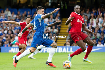 2023-08-13 - Liverpool defender Ibrahima Konaté (5) battles with Chelsea midfielder Enzo Fernandez (8) during the English championship Premier League football match between Chelsea and Liverpool on 13 August 2023 at Stamford Bridge in London, England - FOOTBALL - ENGLISH CHAMP - CHELSEA V LIVERPOOL - ENGLISH PREMIER LEAGUE - SOCCER