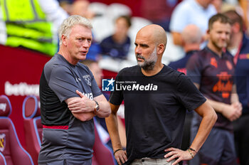 2023-09-16 - David Moyes Manager of West Ham United an Pep Guardiola Manager of Manchester City during the Premier League match between West Ham United and Manchester City at the London Stadium, London, England on 16 September 2023. Photo Nigel Keene/ProSportsImages / DPPI - FOOTBALL - ENGLISH CHAMP - WEST HAM V MANCHESTER CITY - ENGLISH PREMIER LEAGUE - SOCCER