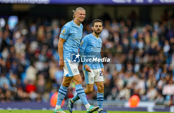 2023-10-21 - Erling Haaland (9) and Bernardo Silva (20) of Manchester City celebrate at full time during the English championship Premier League football match between Manchester City and Brighton and Hove Albion on 21 October 2023 at the Etihad Stadium in Manchester, England - FOOTBALL - ENGLISH CHAMP - MANCHESTER CITY V BRIGHTON - ENGLISH PREMIER LEAGUE - SOCCER