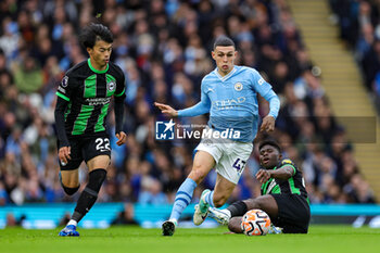 2023-10-21 - Phil Foden (47) of Manchester City and Kaoru Mitoma (22) of Brighton during the English championship Premier League football match between Manchester City and Brighton and Hove Albion on 21 October 2023 at the Etihad Stadium in Manchester, England - FOOTBALL - ENGLISH CHAMP - MANCHESTER CITY V BRIGHTON - ENGLISH PREMIER LEAGUE - SOCCER