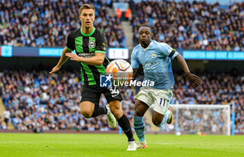 2023-10-21 - Joel Veltman (34) of Brighton & Hove Albion and Jeremy Doku (11) of Manchester City during the English championship Premier League football match between Manchester City and Brighton and Hove Albion on 21 October 2023 at the Etihad Stadium in Manchester, England - FOOTBALL - ENGLISH CHAMP - MANCHESTER CITY V BRIGHTON - ENGLISH PREMIER LEAGUE - SOCCER