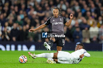 2023-10-23 - Destiny Udogie (38) of Tottenham Hotspur slides in and tackles Bobby Reid (14) of Fulham during the English championship Premier League football match between Tottenham Hotspur and Fulham on 23 October 2023 at Tottenham Hotspur Stadium in London, England - FOOTBALL - ENGLISH CHAMP - TOTTENHAM V FULHAM - ENGLISH PREMIER LEAGUE - SOCCER