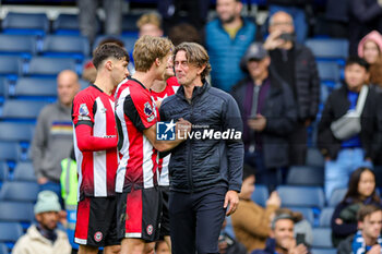 2023-10-29 - Thomas Frank Manager of Brentford celebrates with Mads Roerslev (30) at full time during the English championship Premier League football match between Chelsea and Brentford on 28 October 2023 at Stamford Bridge in London, England - FOOTBALL - ENGLISH CHAMP - CHELSEA V BRENTFORD - ENGLISH PREMIER LEAGUE - SOCCER