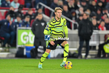 2023-11-25 - Arsenal midfielder Martin Odegaard during the English championship Premier League football match between Brentford and Arsenal on 25 November 2023 at Gtech Community Stadium in Brentford, England - FOOTBALL - ENGLISH CHAMP - BRENTFORD V ARSENAL - ENGLISH PREMIER LEAGUE - SOCCER