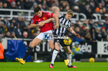 2023-12-02 - Anthony Gordon of Newcastle and Harry Maguire of Manchester United during the English championship Premier League football match between Newcastle United and Manchester United on 2 December 2023 at St James’ Park in Newcastle, England - FOOTBALL - ENGLISH CHAMP - NEWCASTLE V MANCHESTER UNITED - ENGLISH PREMIER LEAGUE - SOCCER