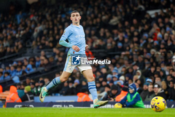2023-12-03 - Manchester City midfielder Phil Foden during the English championship Premier League football match between Manchester City and Tottenham Hotspur on 3 December 2023 at the Etihad Stadium in Manchester, England - FOOTBALL - ENGLISH CHAMP - MANCHESTER CITY V TOTTENHAM - ENGLISH PREMIER LEAGUE - SOCCER