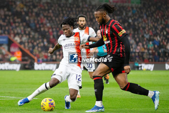 2023-12-16 - Luton Town defender Issa Kaboré (12) battles with Bournemouth forward Antoine Semenyo (24) during the English championship Premier League football match between Bournemouth and Luton Town on 16 December 2023 at the Vitality Stadium in Bournemouth, England - FOOTBALL - ENGLISH CHAMP - BOURNEMOUTH V LUTON TOWN - ENGLISH PREMIER LEAGUE - SOCCER
