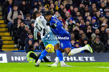 2023-12-27 - Eberechi Eze (10) of Crystal Palace brings down Noni Madueke (11) of Chelsea for a penalty during the English championship Premier League football match between Chelsea and Crystal Palace on 27 December 2023 at Stamford Bridge in London, England - FOOTBALL - ENGLISH CHAMP - CHELSEA V CRYSTAL PALACE - ENGLISH PREMIER LEAGUE - SOCCER