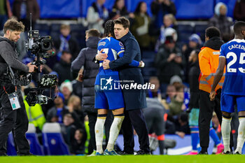 2023-12-27 - Mauricio Pochettino Manager of Chelsea hugs Malo Gusto (27) of Chelsea at full time during the English championship Premier League football match between Chelsea and Crystal Palace on 27 December 2023 at Stamford Bridge in London, England - FOOTBALL - ENGLISH CHAMP - CHELSEA V CRYSTAL PALACE - ENGLISH PREMIER LEAGUE - SOCCER