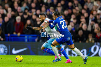 2023-12-27 - Jordan Ayew (9) of Crystal Palace battles with Malo Gusto (27) of Chelsea during the English championship Premier League football match between Chelsea and Crystal Palace on 27 December 2023 at Stamford Bridge in London, England - FOOTBALL - ENGLISH CHAMP - CHELSEA V CRYSTAL PALACE - ENGLISH PREMIER LEAGUE - SOCCER