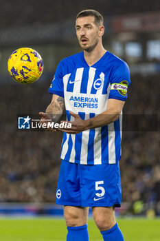 2023-12-28 - Brighton & Hove Albion FC defender Lewis Dunk during the English championship Premier League football match between Brighton and Hove Albion and Tottenham Hotspur on 28 December 2023 at the American Express Stadium in Brighton and Hove, England - FOOTBALL - ENGLISH CHAMP - BRIGHTON V TOTTENHAM - ENGLISH PREMIER LEAGUE - SOCCER