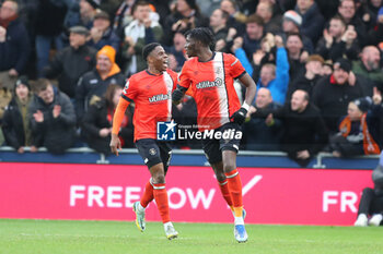 2023-12-30 - Luton Town Forward Elijah Adebayo 11 celebrates his goal 2-3 during the English championship Premier League football match between Luton Town and Chelsea on 30 December 2023 at Kenilworth Road in Luton, England - FOOTBALL - ENGLISH CHAMP - LUTON TOWN V CHELSEA - ENGLISH PREMIER LEAGUE - SOCCER