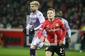 2023-02-16 - Florian Wirtz of Bayer Leverkusen and Caio Henrique of AS Monaco during the UEFA Europa League, Play-off, 1st leg football match between Bayer Leverkusen and AS Monaco on February 16, 2023 at BayArena in Leverkusen, Germany - FOOTBALL - EUROPA LEAGUE - LEVERKUSEN V MONACO - UEFA EUROPA LEAGUE - SOCCER