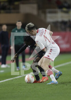 2023-02-23 - Jeremie Frimpong of Bayer 04 Leverkusen and Aleksandr Golovin of As Monaco during the Uefa Europa League, football match between As Monaco and Bayer 04 Leverkusen,on 23 February 2023 at State Luis II in Monaco, Photo Ndrerim Kaceli - AS MONACO VS BAYER LEVERKUSEN - UEFA EUROPA LEAGUE - SOCCER