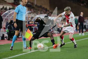 2023-02-23 - Jeremie Frimpong of Bayer 04 Leverkusen and Caio Henrique of As Monaco during the Uefa Europa League, football match between As Monaco and Bayer 04 Leverkusen,on 23 February 2023 at State Luis II in Monaco, Photo Ndrerim Kaceli - AS MONACO VS BAYER LEVERKUSEN - UEFA EUROPA LEAGUE - SOCCER